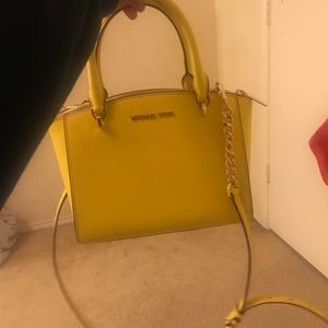 yellow Micheal Kors crossbody bag